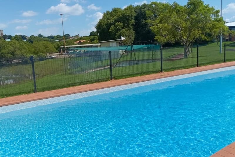 Clearview-style mesh security fencing around a property