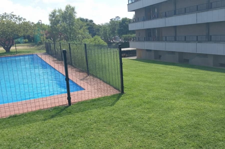 Security fencing around a swimming pool area