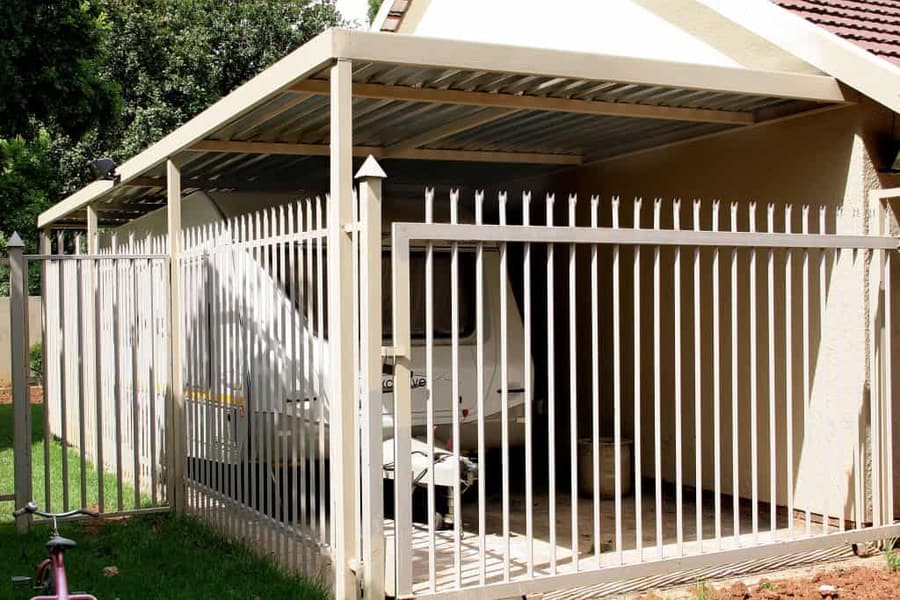Palisade fencing with a matching driveway gate