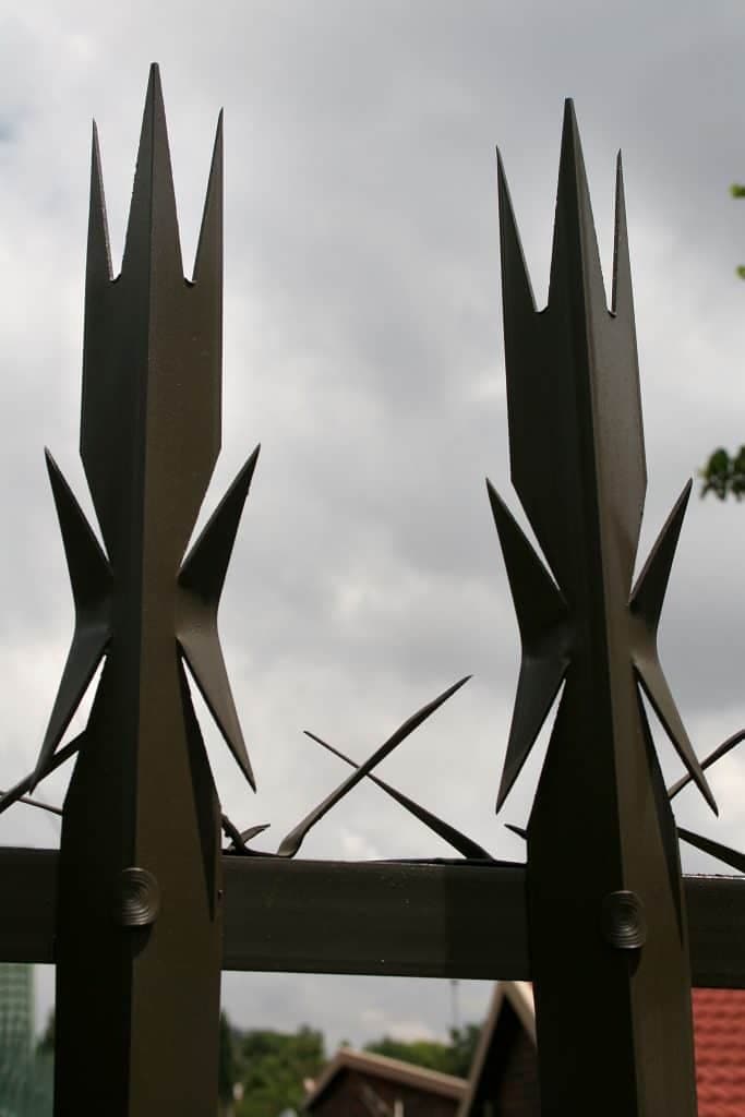 Close-up of galvanised palisade pales