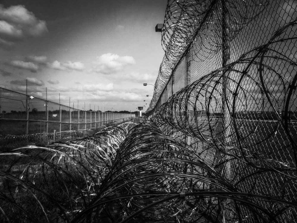 High-security perimeter fencing with razor wire