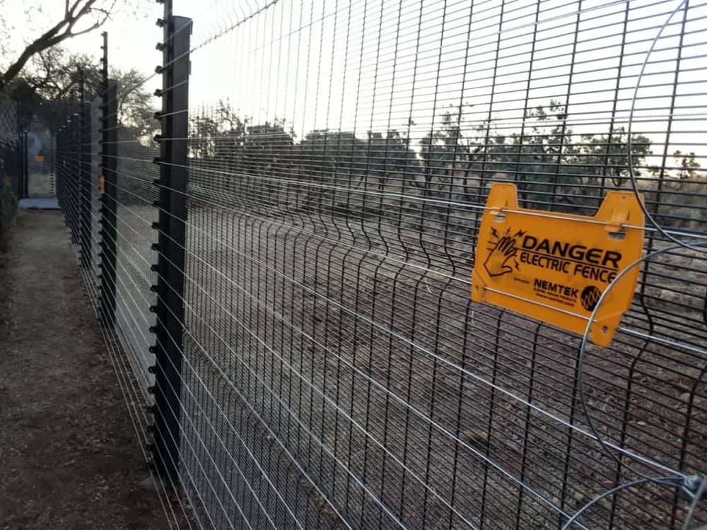 Clearview-style mesh security fencing along a boundary